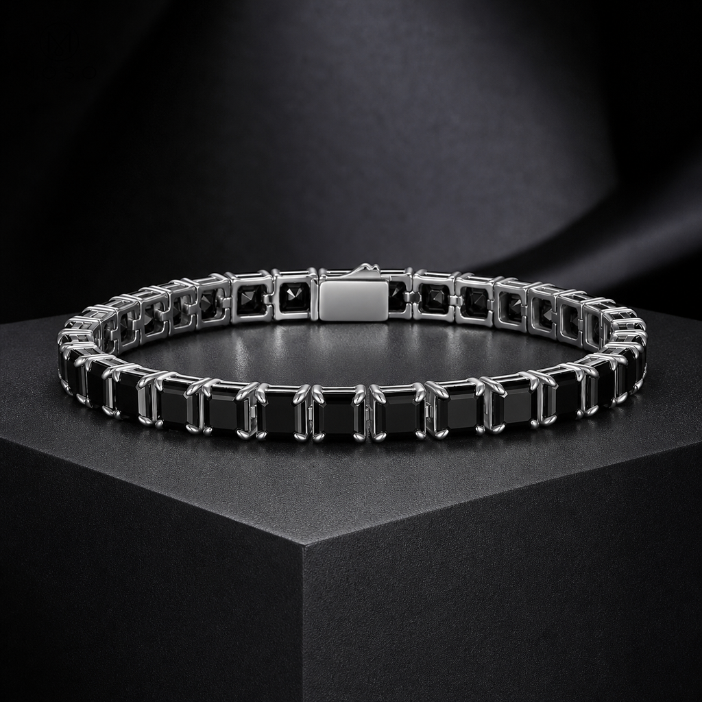 Lucy black moissanite tennis bracelet on a charcoal pedestal