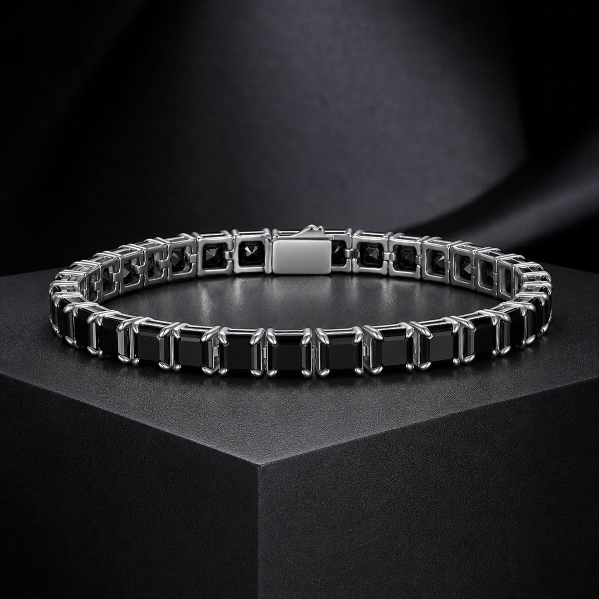 Lucy black moissanite tennis bracelet on a charcoal pedestal