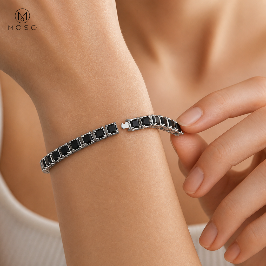 Woman fastening the Lucy black moissanite tennis bracelet