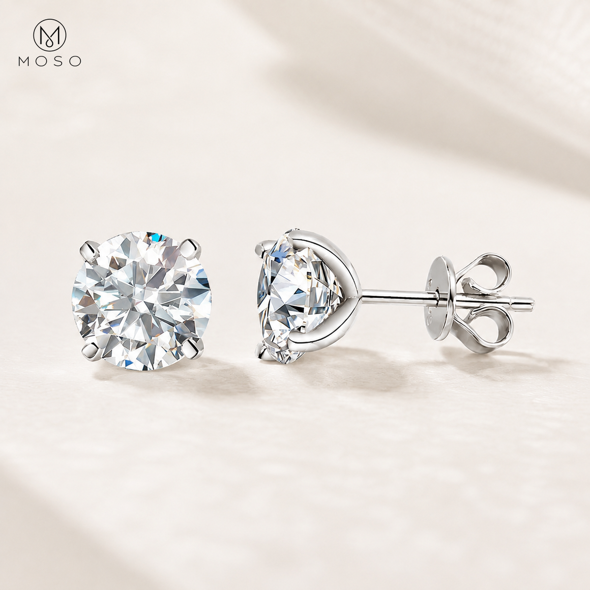 Mia round moissanite stud earrings in silver tone on a soft ivory background
