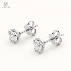 Mia round moissanite stud earrings showing the open basket, posts and butterfly backs
