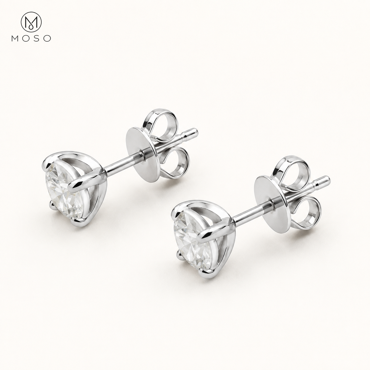 Mia round moissanite stud earrings showing the open basket, posts and butterfly backs