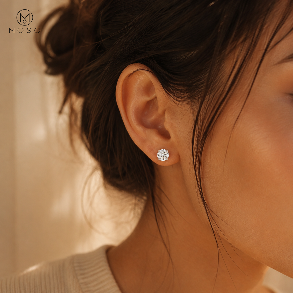 Mia round moissanite stud earring worn in warm natural daylight