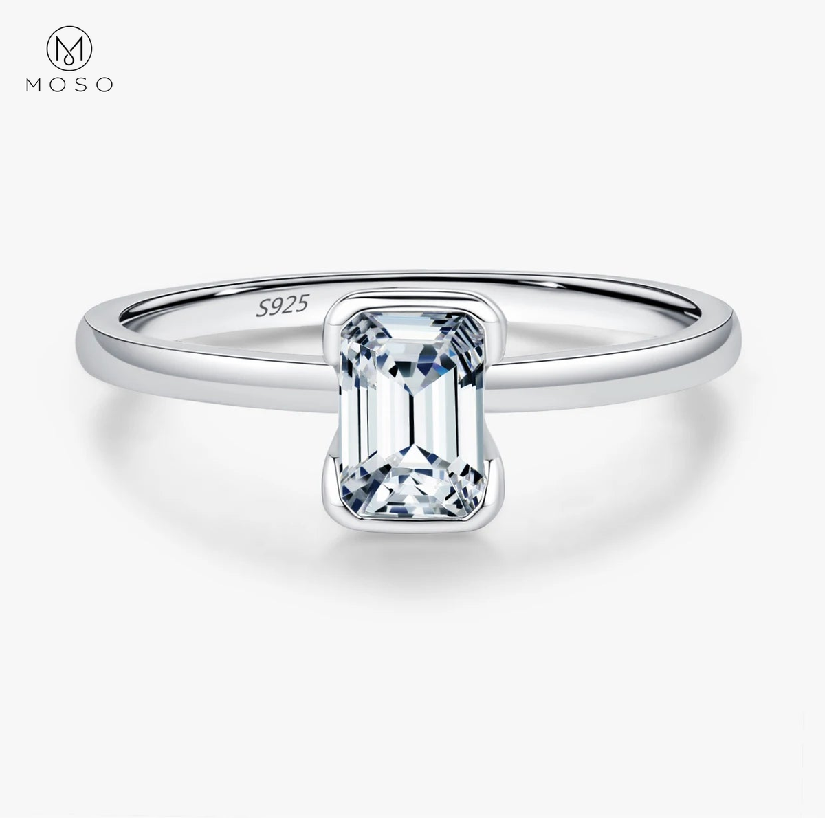 Complete emerald-cut moissanite sterling silver ring centered on a clean white background