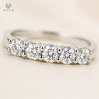Natalie round moissanite stones and shared prongs close up