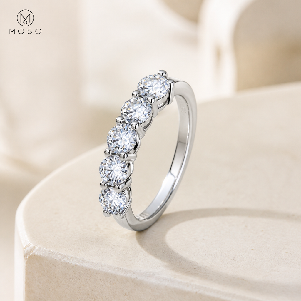 Natalie moissanite wedding band on ivory pedestal