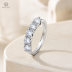 Natalie moissanite wedding band on ivory pedestal