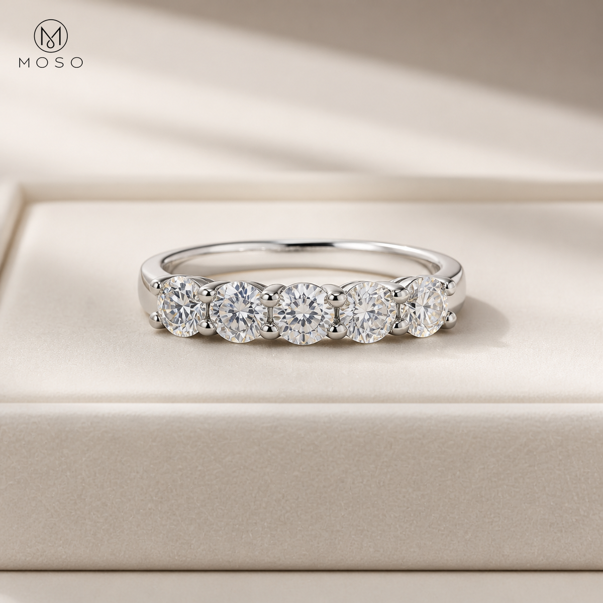 Natalie round moissanite wedding band on cream tray