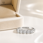 Natalie moissanite wedding band beside cream jewellery box