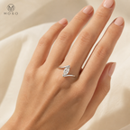Woman wearing Olivia silver tone marquise moissanite ring
