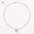 Penelope silver tone moissanite flower necklace on ivory background