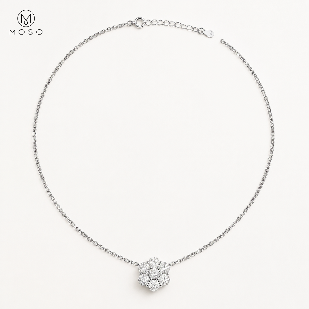 Penelope silver tone moissanite flower necklace on ivory background