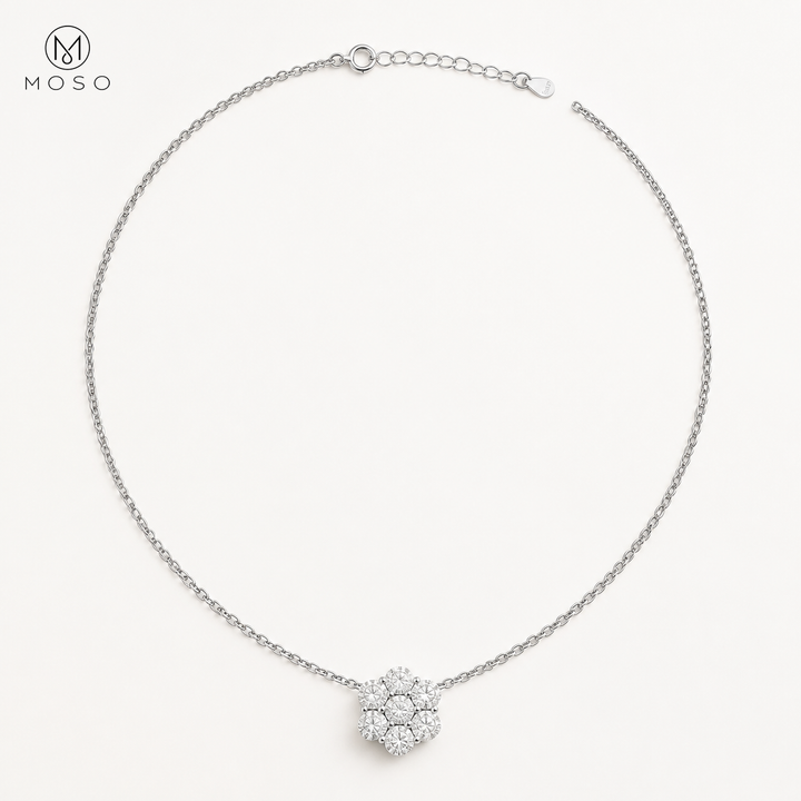 Penelope silver tone moissanite flower necklace on ivory background