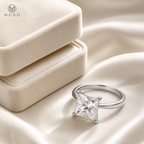 Riley princess cut moissanite ring beside cream jewellery box
