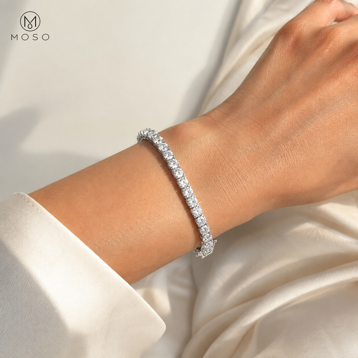 Samantha 4mm silver tone moissanite tennis bracelet worn on an adult wrist