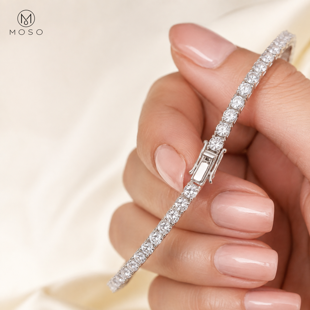 Samantha silver tone moissanite tennis bracelet held by an adult hand