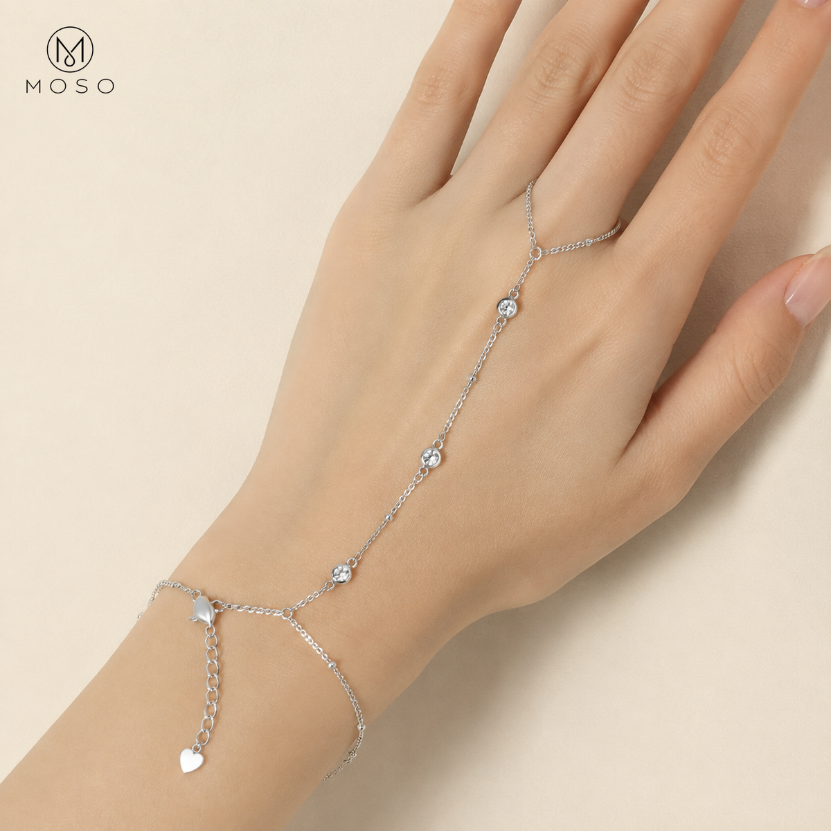 Savannah silver tone moissanite hand chain bracelet worn on an adult hand