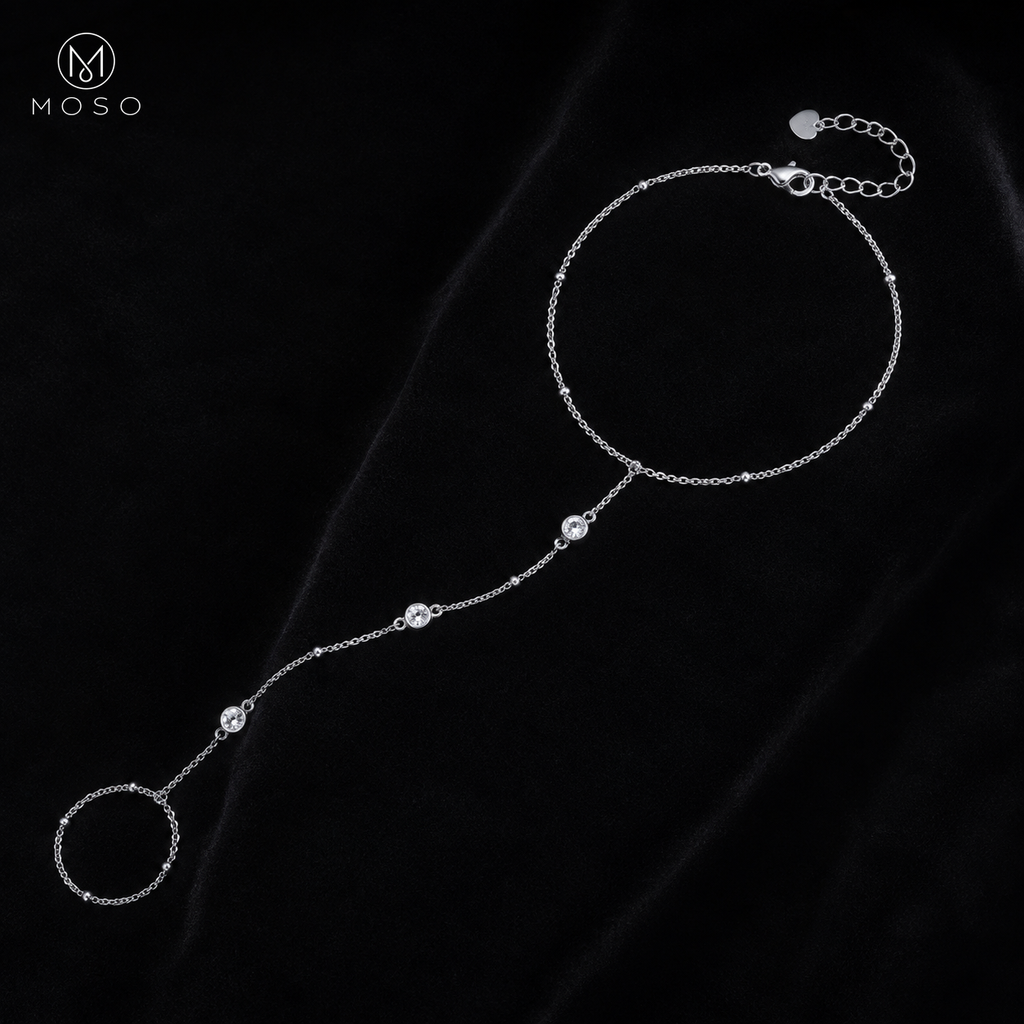 Savannah silver tone moissanite hand chain bracelet displayed on black velvet