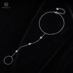 Savannah silver tone moissanite hand chain bracelet displayed on black velvet