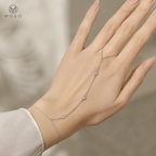 Savannah silver tone moissanite hand chain bracelet showing finger loop and three stones