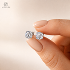 Sophia round moissanite stud earrings held in hand