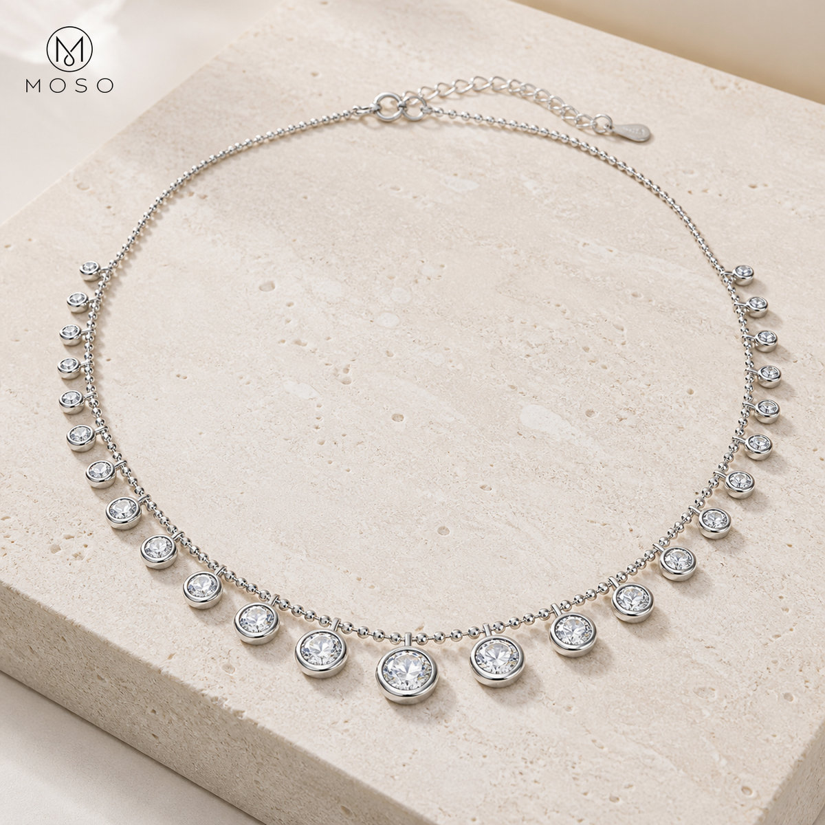 Stella 4.5ct graduated moissanite bubble necklace on warm stone