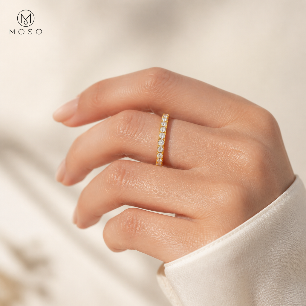 Taylor gold tone moissanite eternity ring worn on hand
