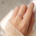 Taylor rose gold tone moissanite eternity ring worn on hand