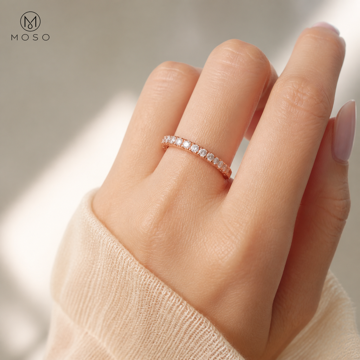 Taylor rose gold tone moissanite eternity ring worn on hand