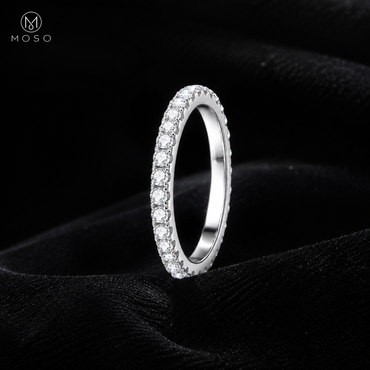 Taylor silver tone moissanite eternity ring on black velvet