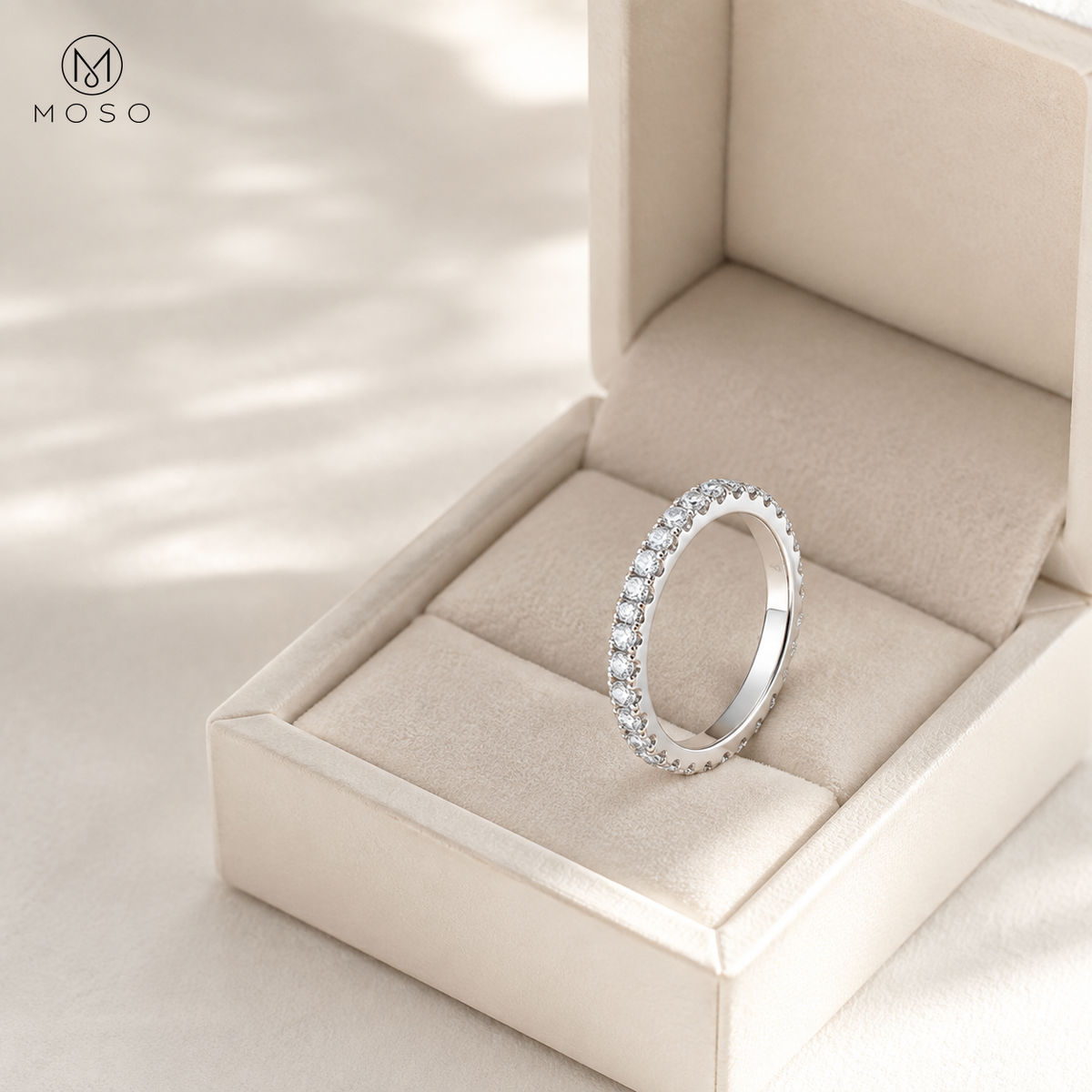 Taylor moissanite eternity ring presented in an ivory jewellery box