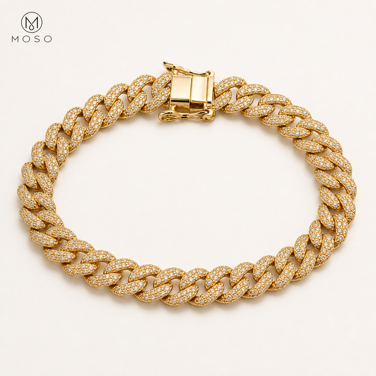 Victoria gold tone moissanite Cuban bracelet on ivory background