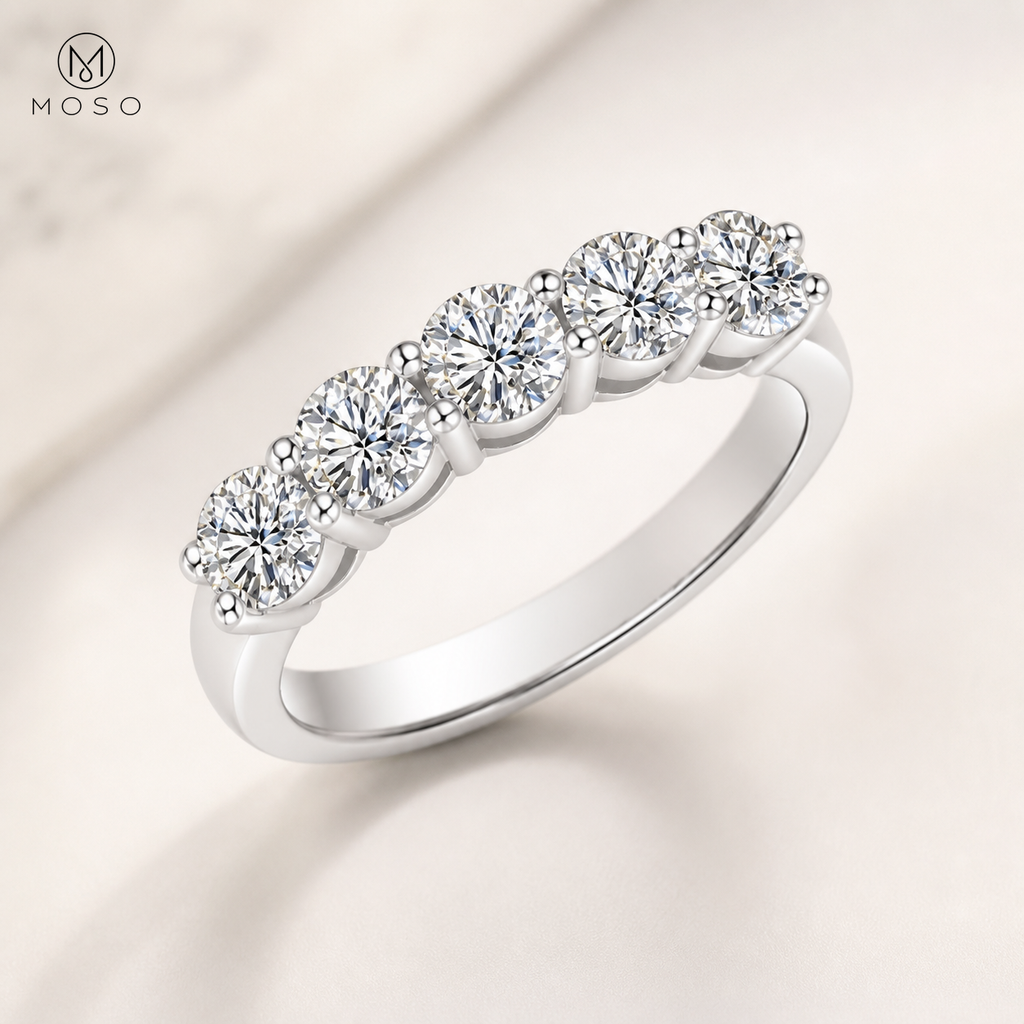 Zoe five stone round moissanite wedding band on ivory background