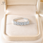 Zoe five stone moissanite ring in cream jewellery box
