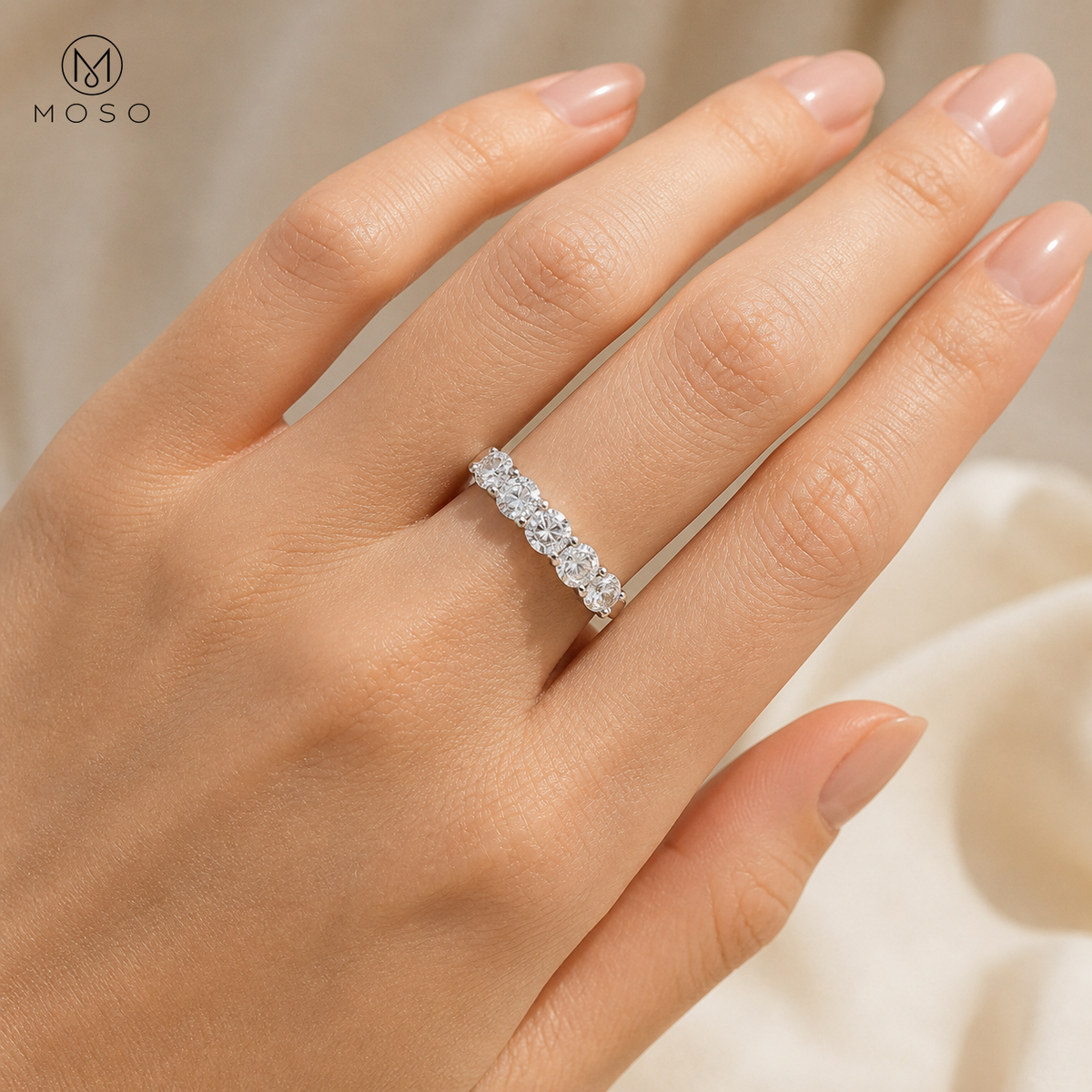 Zoe five stone moissanite wedding band worn on hand